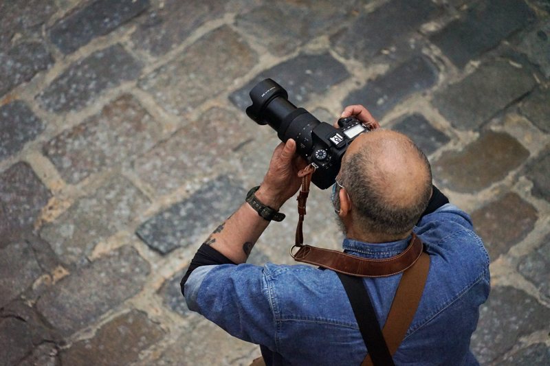Photographer with a telephoto lens